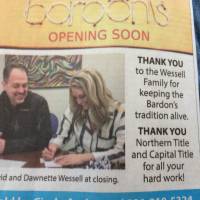 photo of Dawnette and David signing the papers for Bardon's wonder freeze purchase